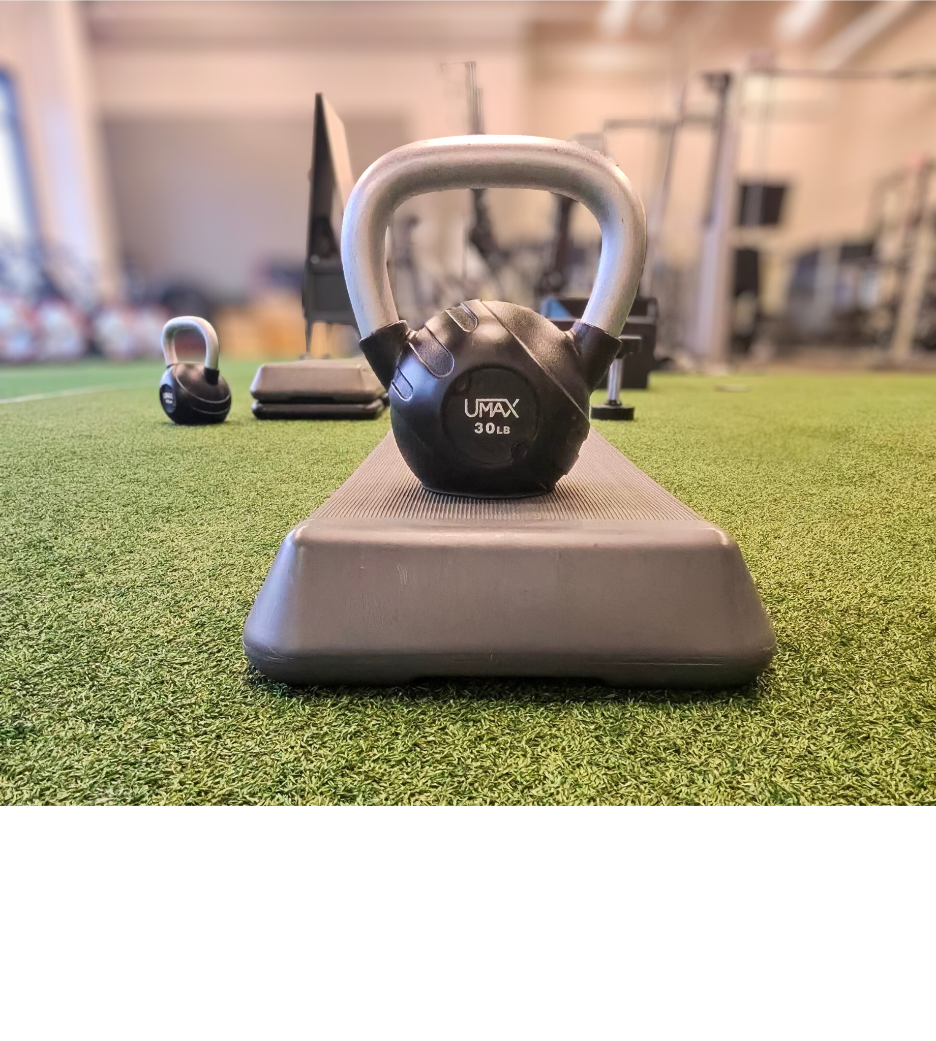 Kettle bell sitting on step platform at gym